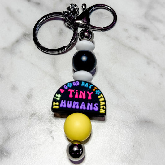 Teach Tiny Humans keychain